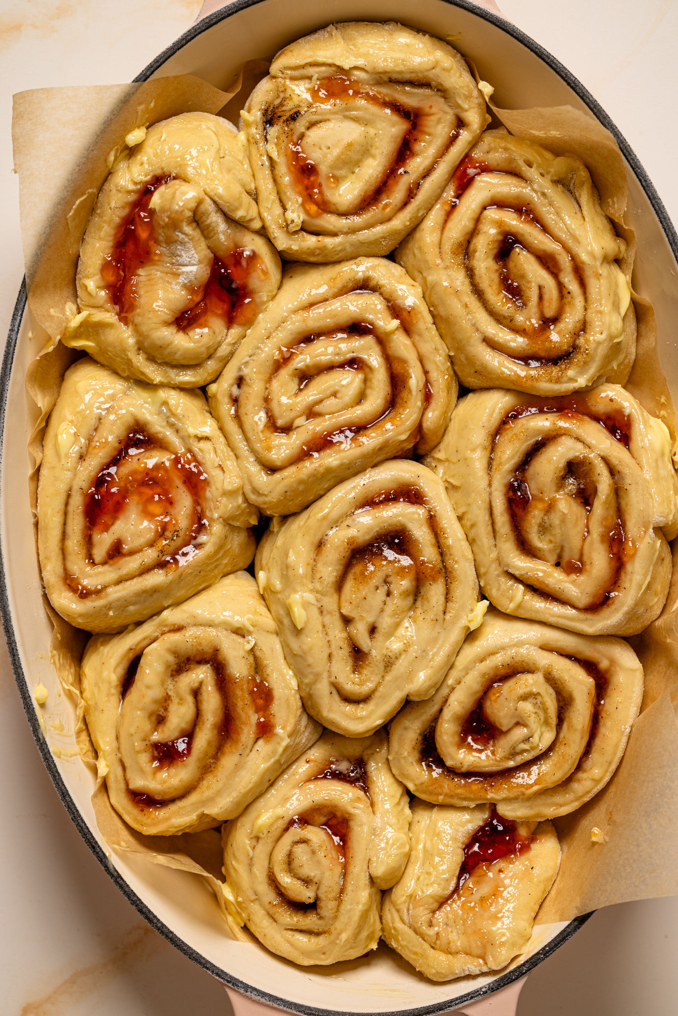 Cinnamon rolls prepared in a baking dish.